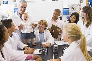 Students in biology class with teacher