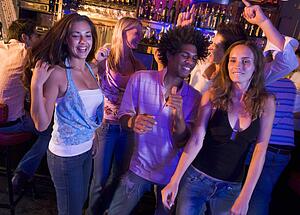 Young people dancing in a bar