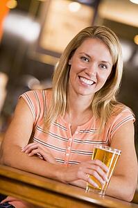Woman having a glass of beer