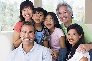 Extended family in living room smiling