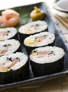 Large Spiral Rolled Sushi with Sushi Ginger Wasabi and Soy Sauce