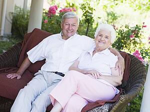 Senior couple sitting outdoors