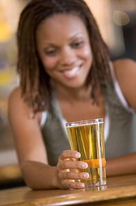 Woman having a glass of beer