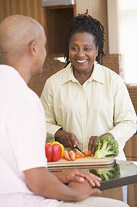Husband And Wife Preparing A meal, mealtime Together