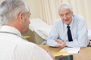 Man in doctor's office smiling
