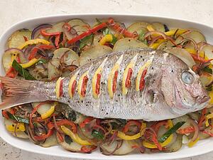 Whole Roasted Bream with Chilies Potatoes and Peppers