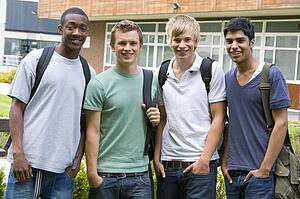 Group of students outdoors looking at camera smiling