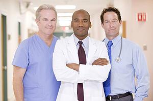 Doctors Standing In A Hospital Corridor
