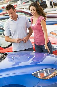 Young couple shopping for a new car