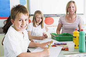 Students in art class with teacher (selective focus)
