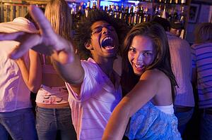 Young people dancing in a bar