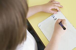 Student in class learning numbers (selective focus)