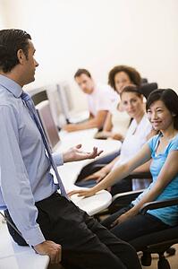 Man giving lecture in computer class