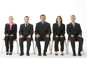 Group Of Business People Sitting In A Line 