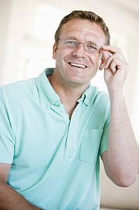 Man Looking Through New Glasses