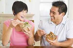 Young Couple Enjoying Chinese Food