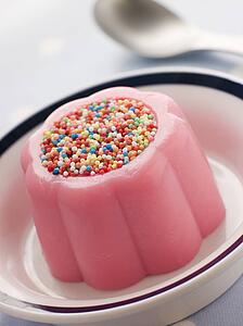 Blancmange topped with 100's and 1000's