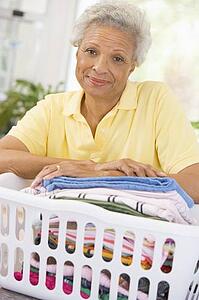 Woman Leaning On Washing Basket 