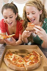 Teenage Girls Eating Pizza 