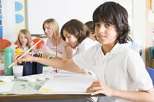 Students in art class with teacher (depth of field)