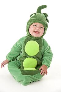 Baby in peas in pod costume smiling