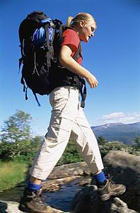 Woman outdoors hiking in scenic location (selective focus)