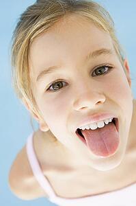 Young girl sticking her tongue out
