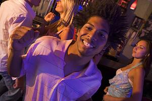 Young people dancing in a bar