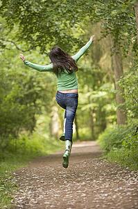 Woman jumping on path