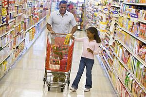 Father and daughter shopping at a grocery store