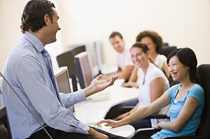 Man giving lecture in computer class