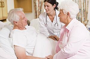 Doctor Talking To Senior Couple