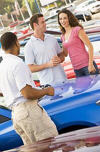 Young couple shopping for a new car