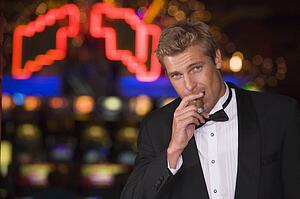 Man in casino with cigar (selective focus)