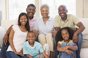 Extended family in living room smiling