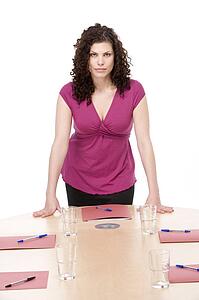 Businesswoman standing in boardroom