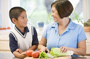 Grandmother And Grandson Preparing meal, mealtime Together