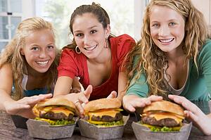 Teenage Girls Eating Burgers 