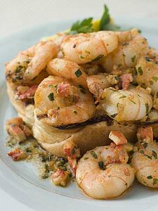 Toasted Brioche topped with Prawns cooked In Lobster Garlic Butter