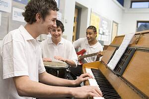 Student musicians practising in classroom