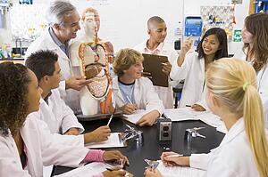 Students in biology class with teacher