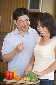Husband And Wife Preparing meal, mealtime Together