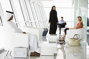 Airline passengers waiting in departure gate
