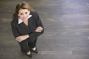 Businesswoman standing indoors smiling