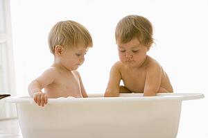 Two babies in bubble bath