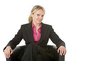 Businesswoman Sitting In Leather Chair