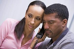 Couple receiving a bad news phone call from clinic