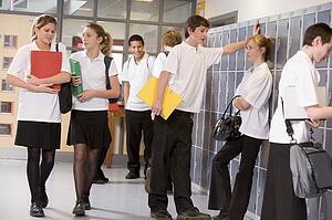 Secondary school students in a school hallway
