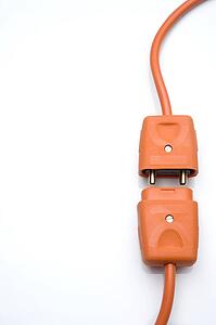 Two Orange Electric Plugs