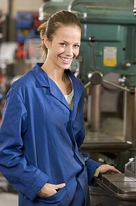 Machinist working on machine